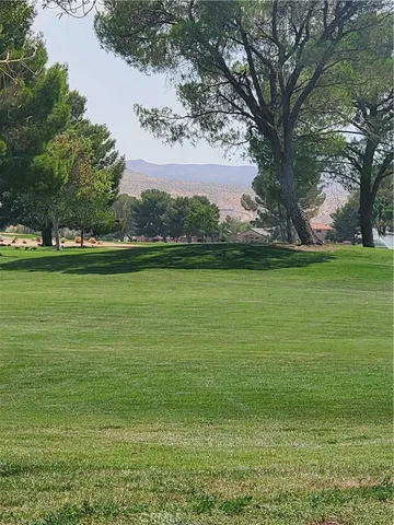 a view of a big yard with a fountain