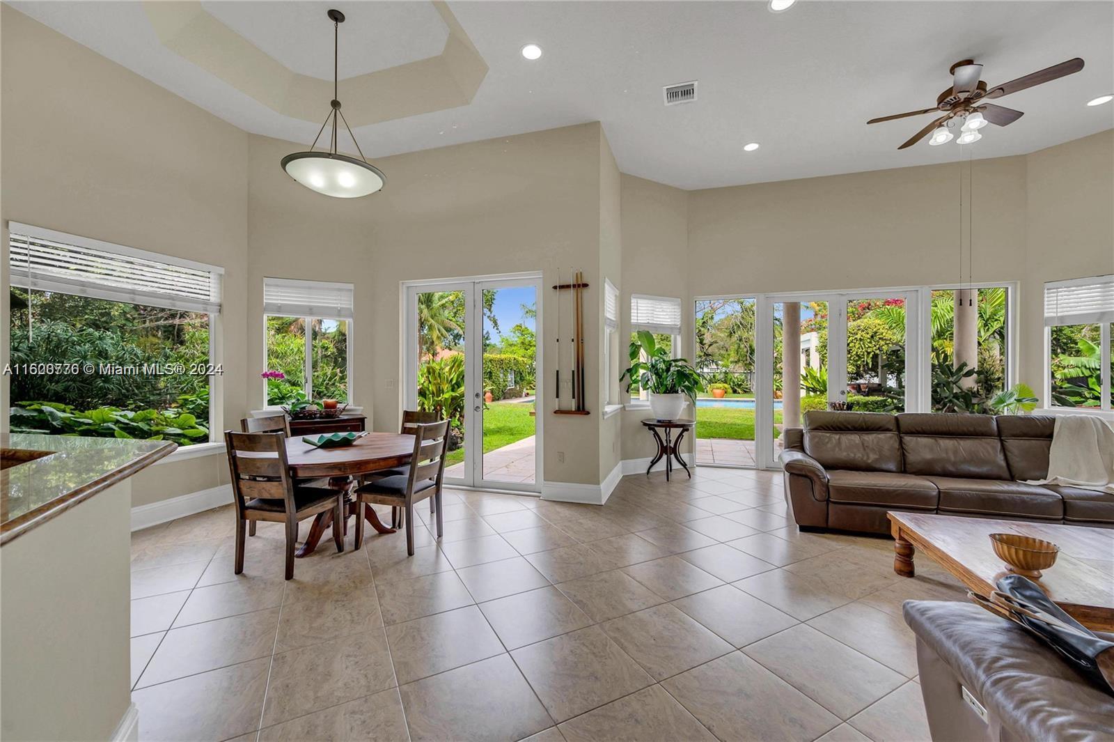 10901 Southwest 91st Street Miami, FL 33176 - Photo 12 of 69 a view of a dining room with furniture window and outside view
