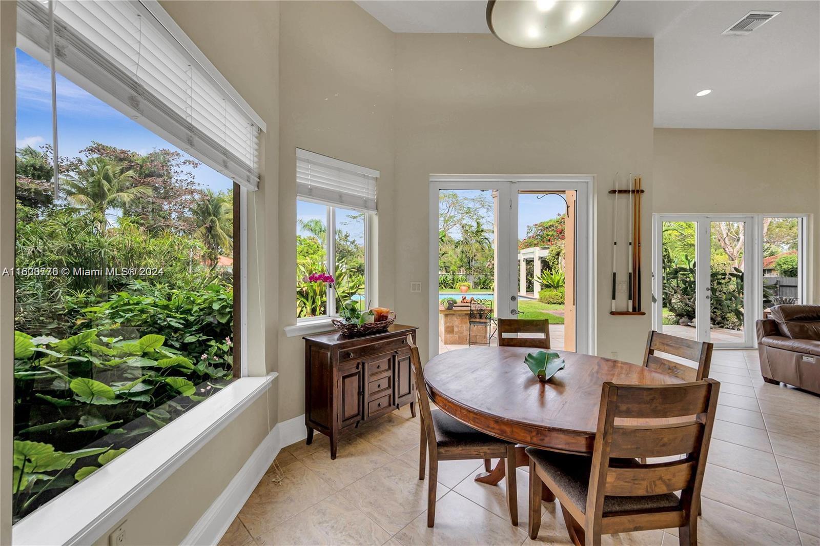 10901 Southwest 91st Street Miami, FL 33176 - Photo 13 of 69 a view of a dining room with furniture window and outside view