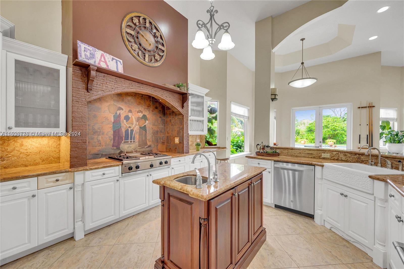 10901 Southwest 91st Street Miami, FL 33176 - Photo 17 of 69 a kitchen with granite countertop a sink stove and cabinets
