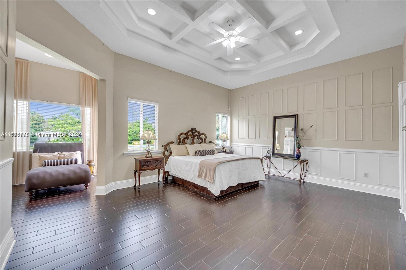 10901 Southwest 91st Street Miami, FL 33176 - Photo 23 of 69 a spacious bedroom with a bed and a couch