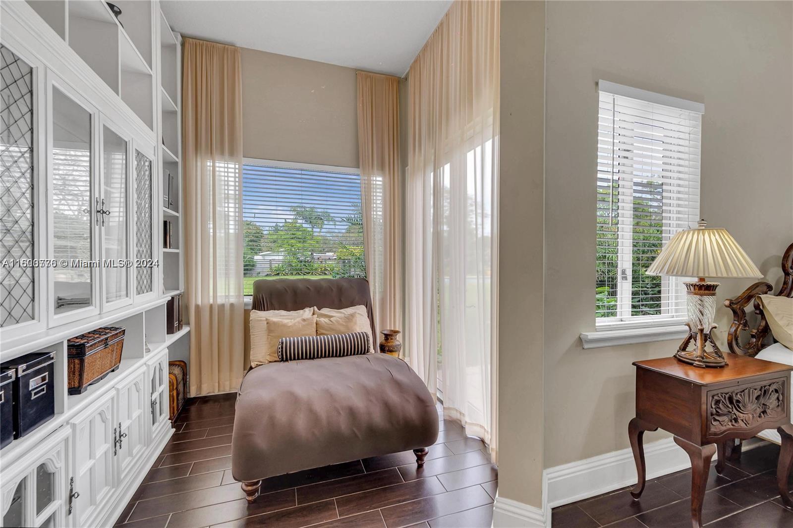 10901 Southwest 91st Street Miami, FL 33176 - Photo 26 of 69 a bedroom with furniture and a window