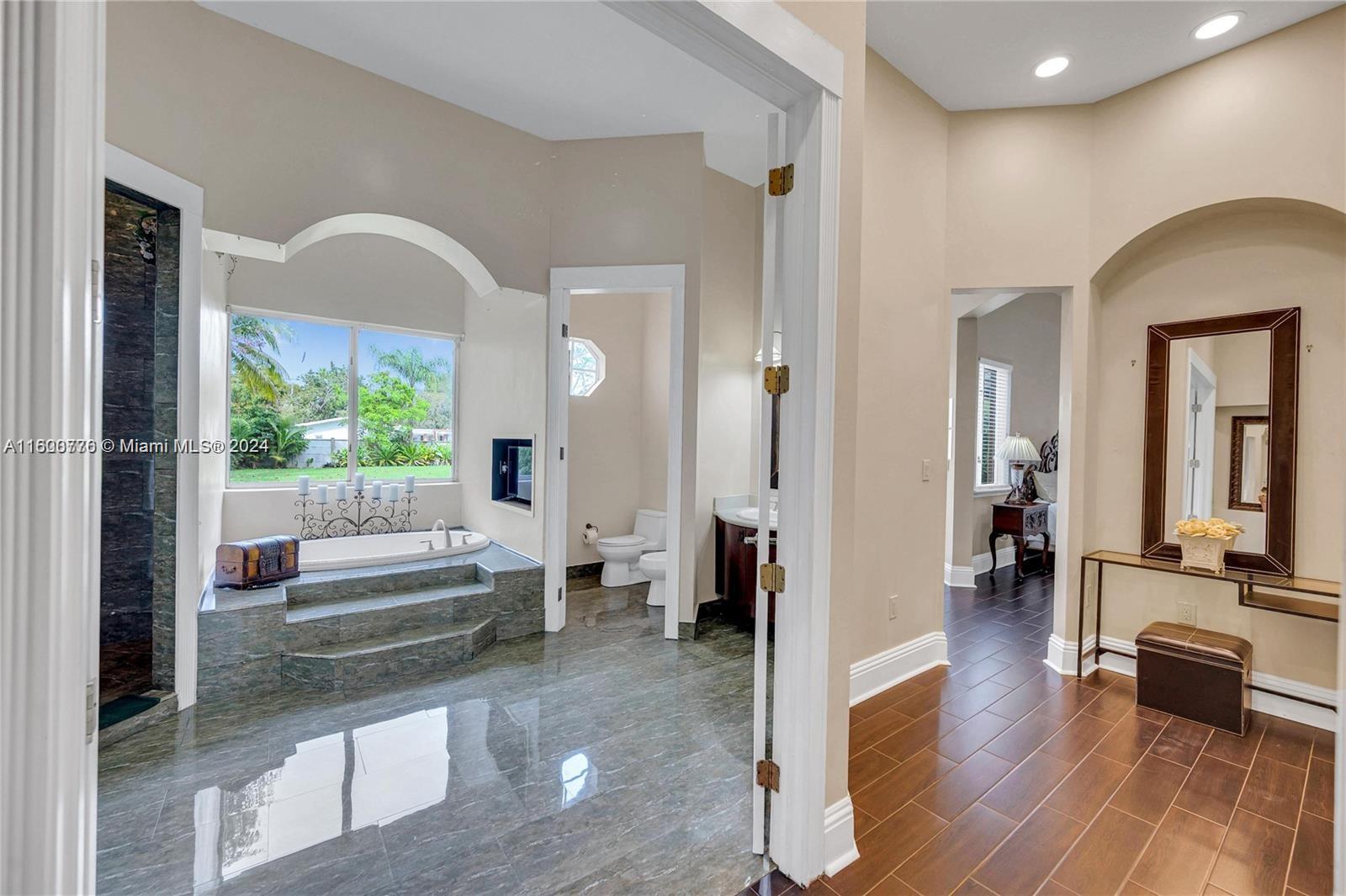 10901 Southwest 91st Street Miami, FL 33176 - Photo 31 of 69 a view of living room and kitchen with wooden floor