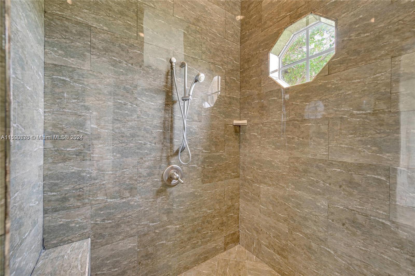 10901 Southwest 91st Street Miami, FL 33176 - Photo 33 of 69 a bathroom with a light fixture and a shower