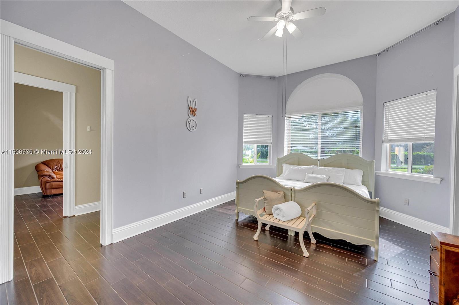 10901 Southwest 91st Street Miami, FL 33176 - Photo 38 of 69 a living room with furniture and a wooden floor