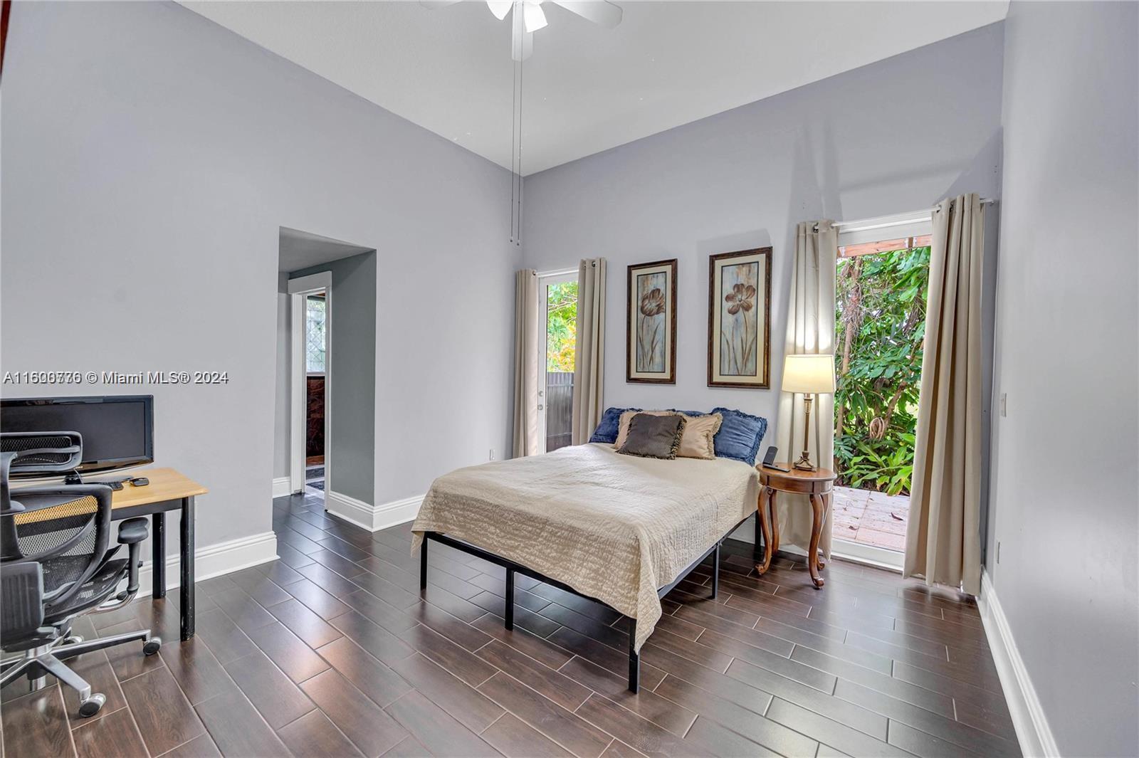 10901 Southwest 91st Street Miami, FL 33176 - Photo 42 of 69 a bedroom with a bed and a table in it