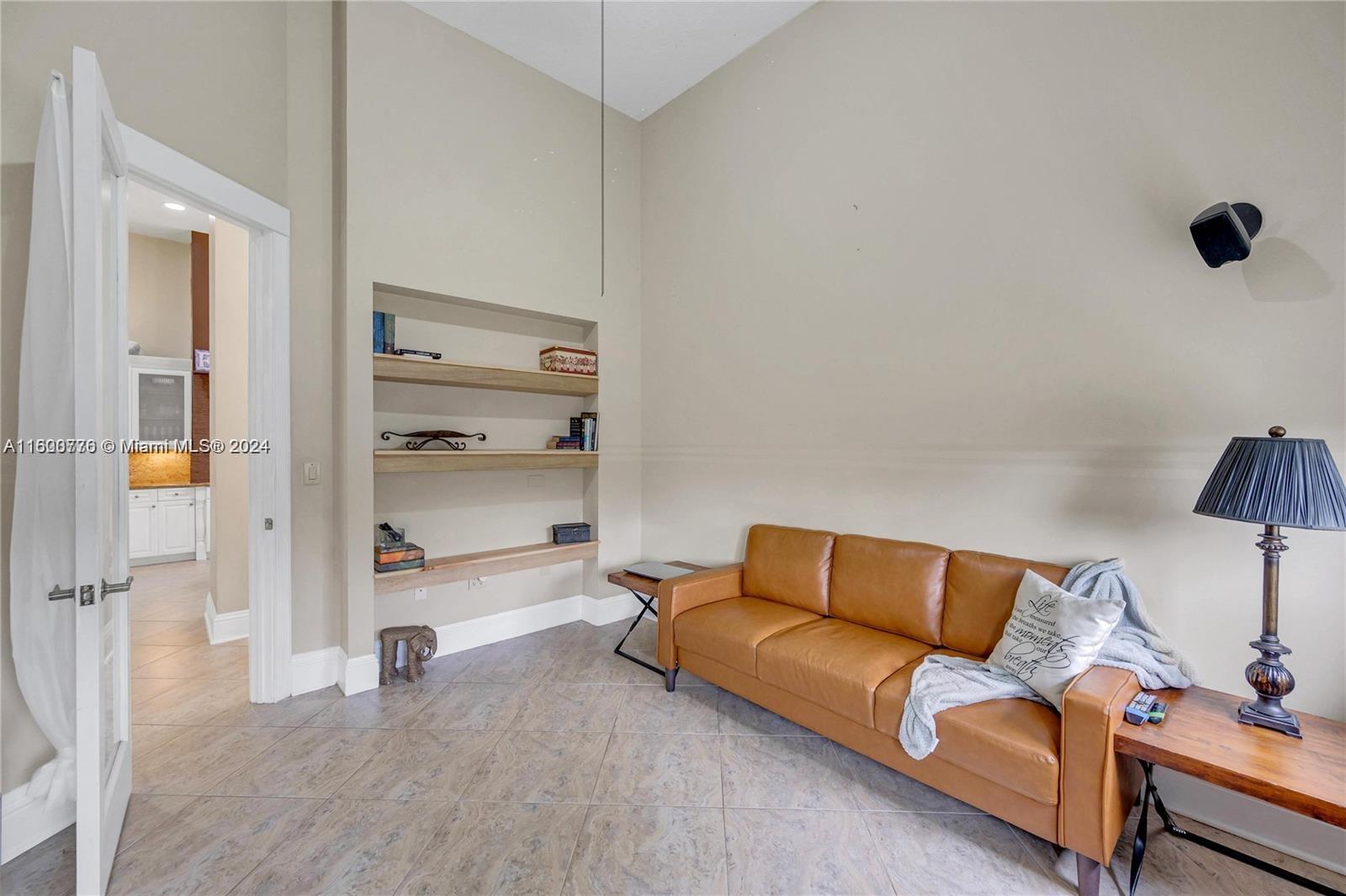 10901 Southwest 91st Street Miami, FL 33176 - Photo 45 of 69 a room with a couch and a walk in closet