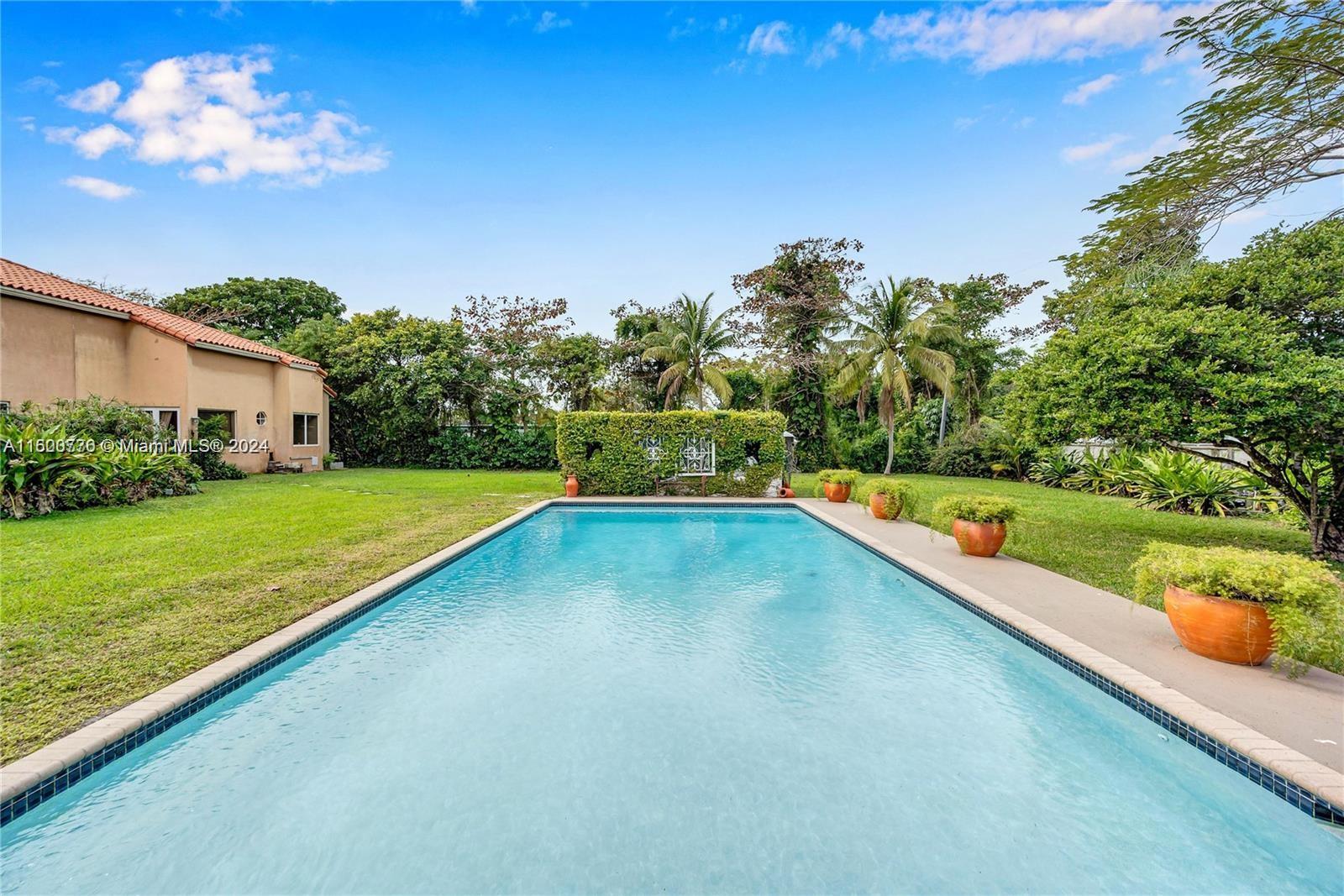 10901 Southwest 91st Street Miami, FL 33176 - Photo 50 of 69 a view of a house with a backyard