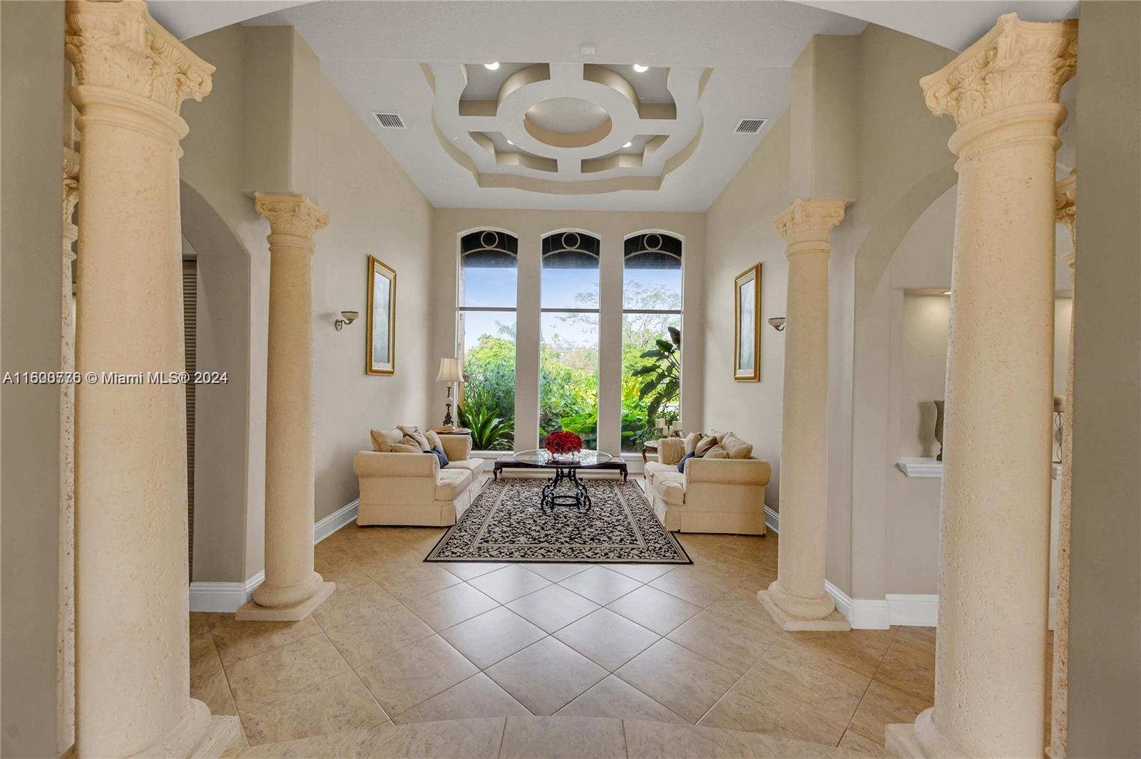 10901 Southwest 91st Street Miami, FL 33176 - Photo 5 of 69 a living room with furniture and floor to ceiling windows