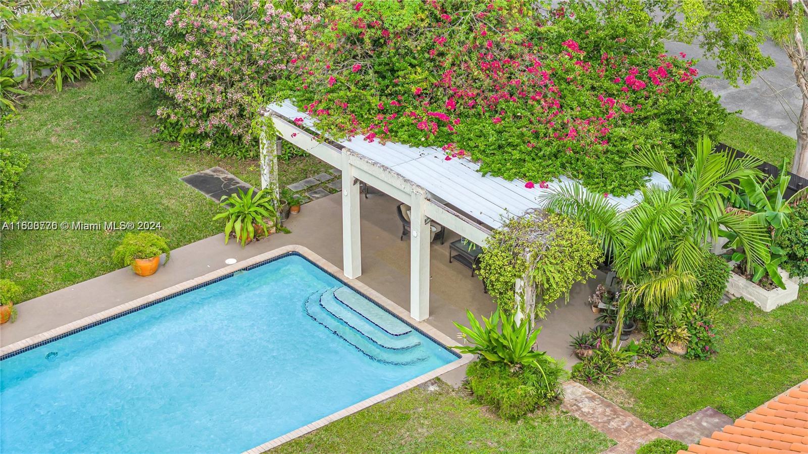 10901 Southwest 91st Street Miami, FL 33176 - Photo 52 of 69 a backyard of a house with lots of green space and plants