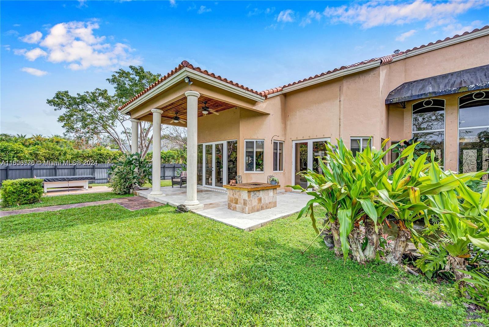 10901 Southwest 91st Street Miami, FL 33176 - Photo 58 of 69 a view of a house with backyard porch and sitting area