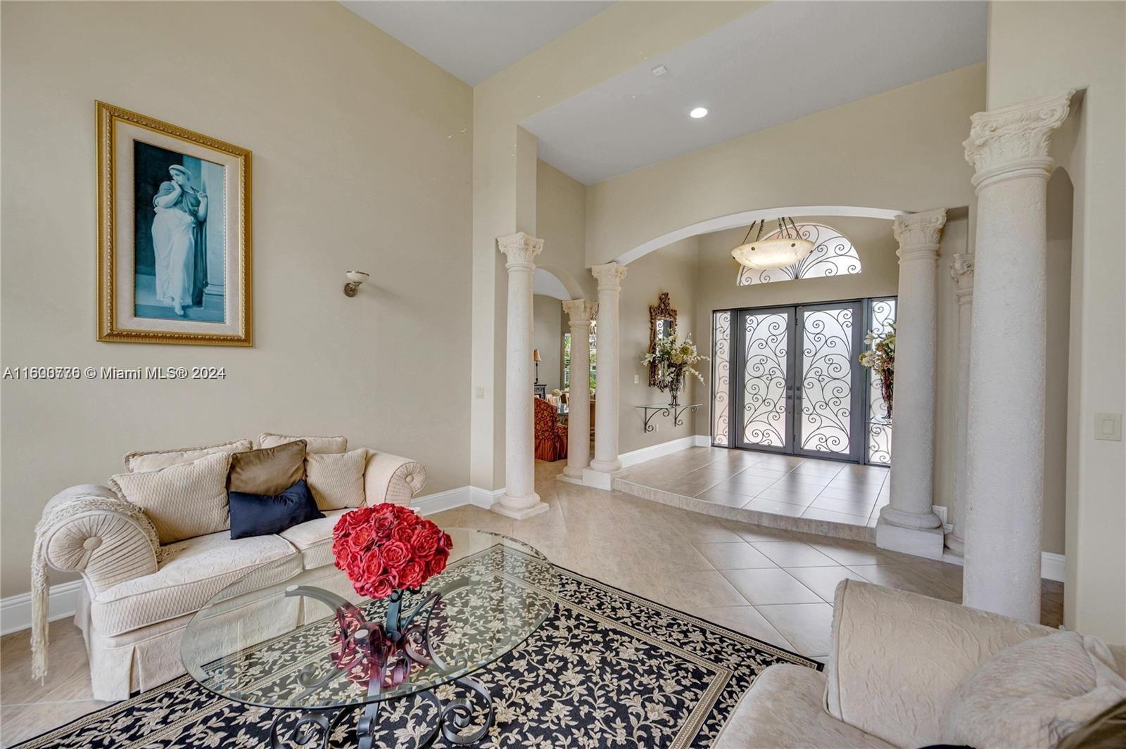 10901 Southwest 91st Street Miami, FL 33176 - Photo 7 of 69 a living room with furniture and a large window