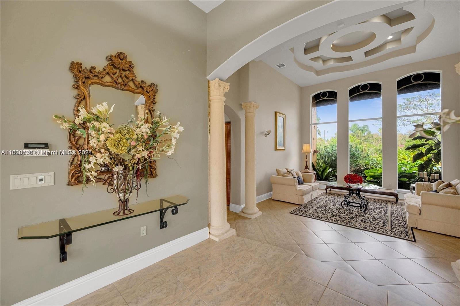 10901 Southwest 91st Street Miami, FL 33176 - Photo 8 of 69 a living room with furniture and a potted plant