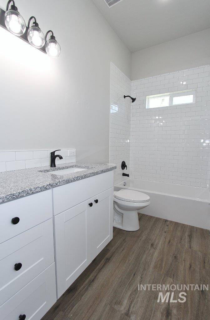 121 Northwest 2nd Street Ontario, OR 97914 - Photo 15 of 32 Contemporary bathroom with white subway tile shower surround and a built-in bathtub