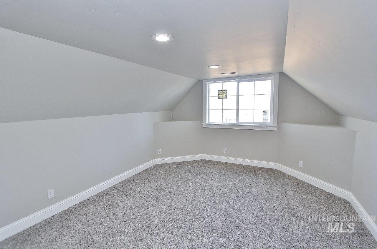 121 Northwest 2nd Street Ontario, OR 97914 - Photo 28 of 32 Additional living space with baseboards and light carpet
