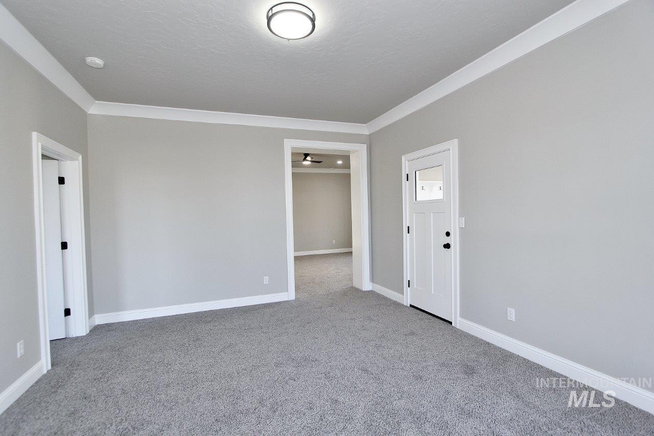 121 Northwest 2nd Street Ontario, OR 97914 - Photo 10 of 32 Unfurnished room featuring carpet and ornamental molding