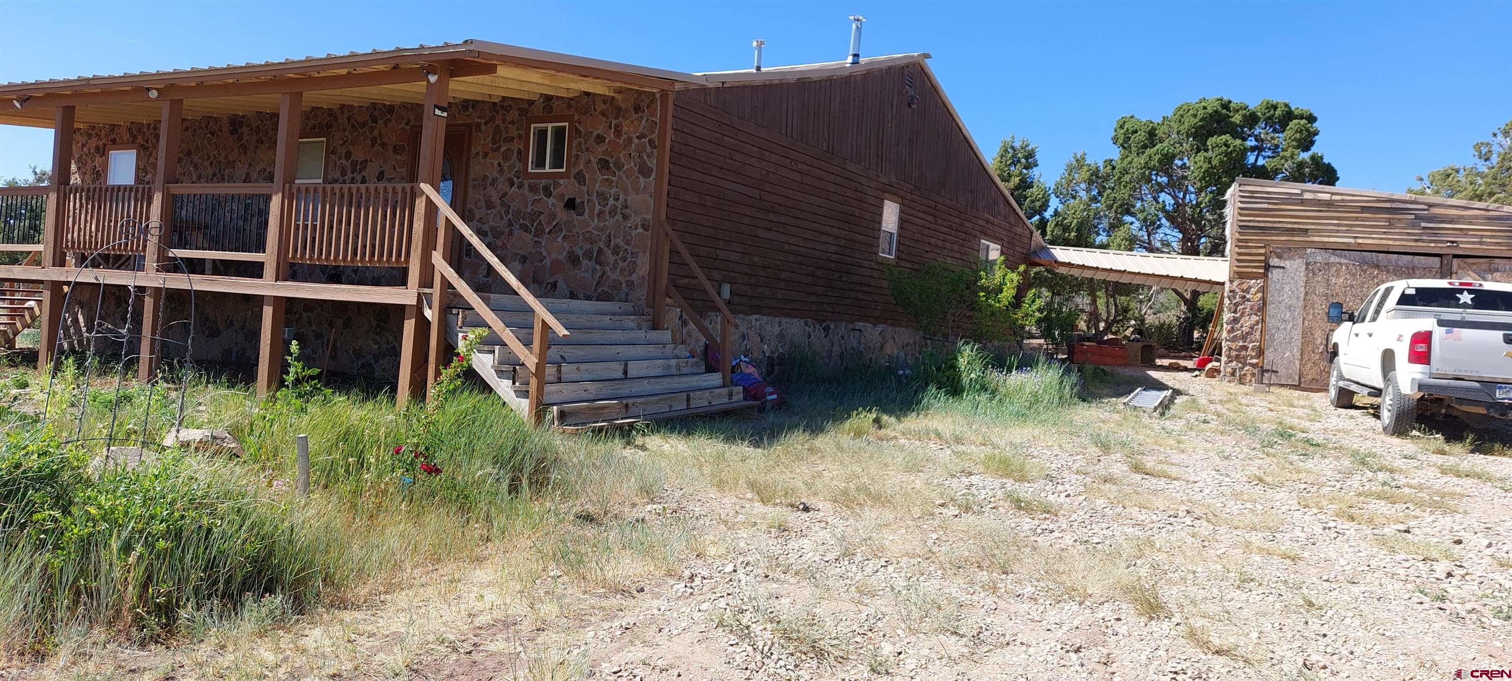 14663 Road N 3 Cahone Co 81320 Cahone, CO 81320 - Photo 14 of 20 a view of a house with a yard
