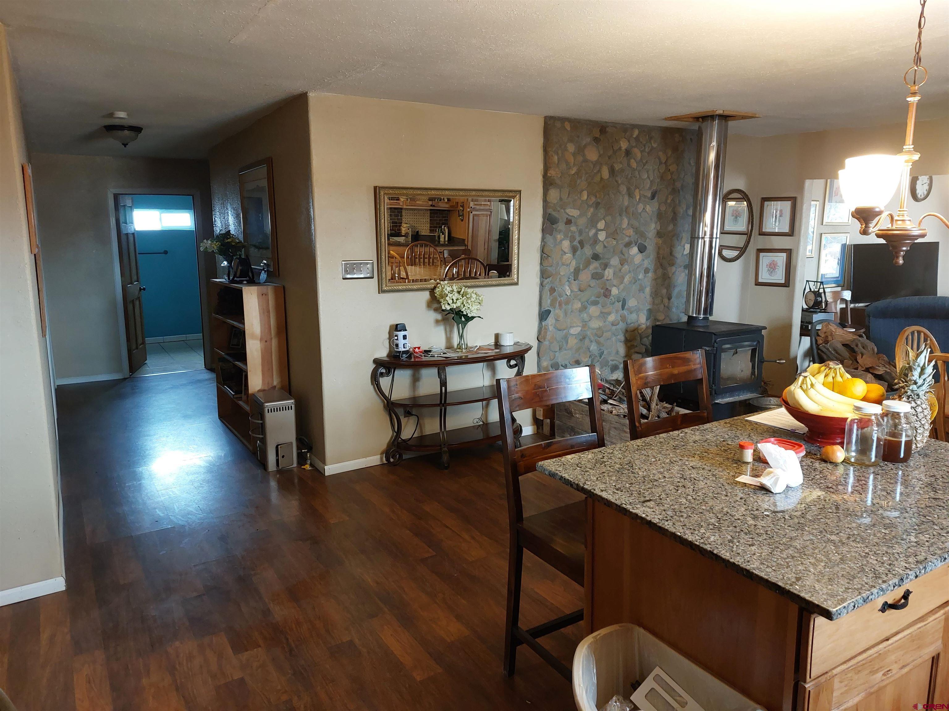 14663 Road N 3 Cahone Co 81320 Cahone, CO 81320 - Photo 4 of 20 a living room with fireplace furniture and a flat screen tv