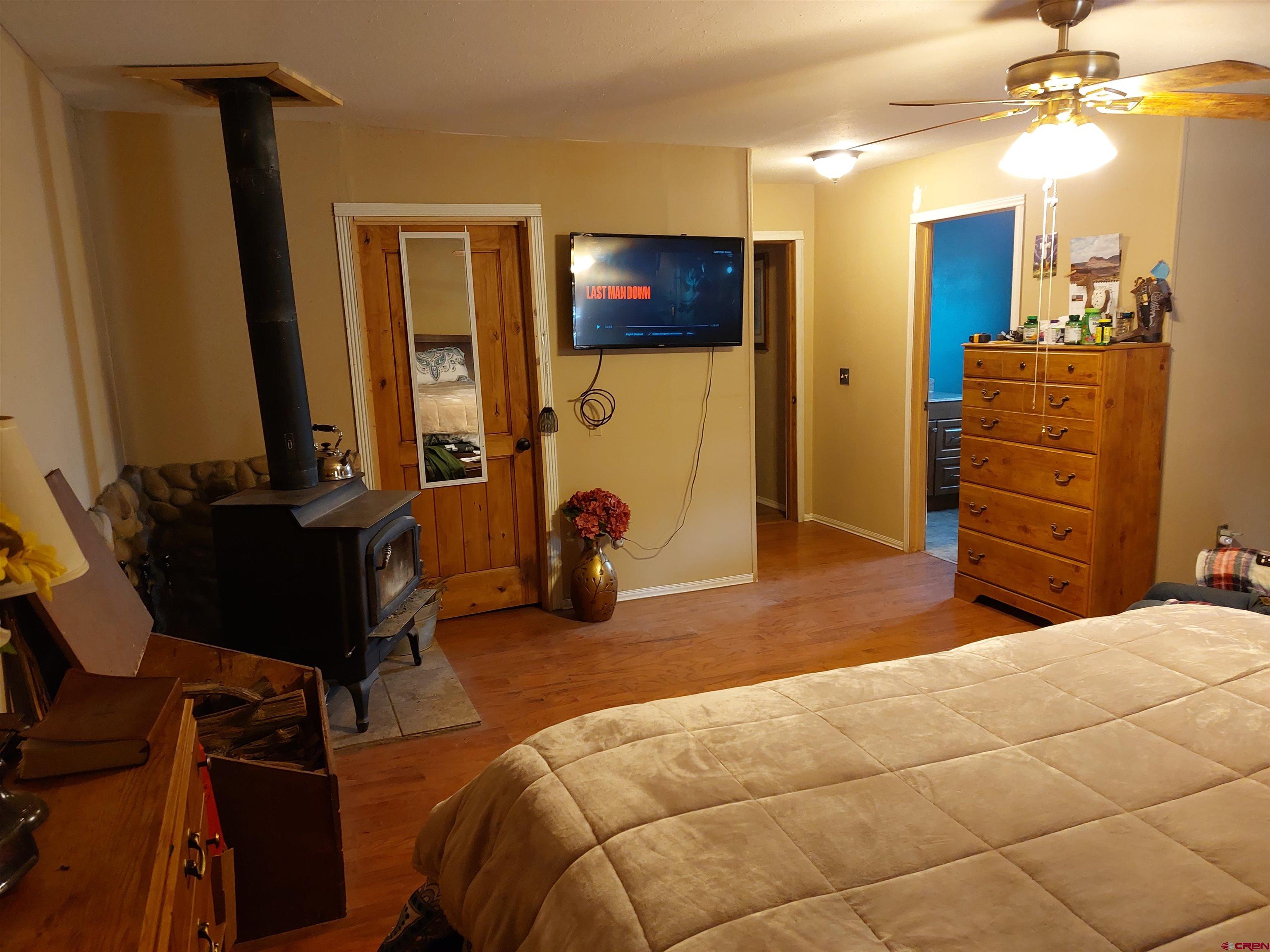 14663 Road N 3 Cahone Co 81320 Cahone, CO 81320 - Photo 10 of 20 a bedroom with a bed and dresser