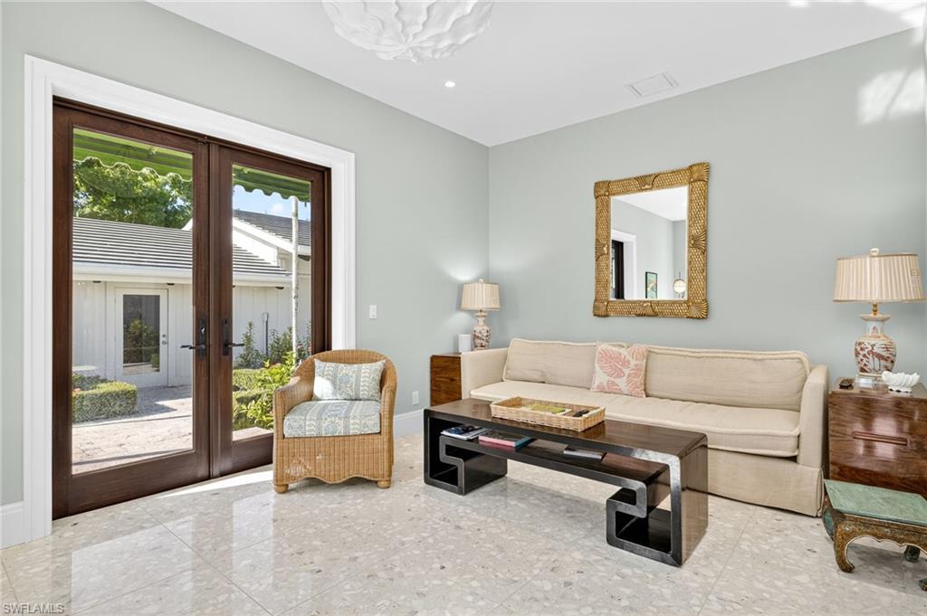 111 Caribbean Road Naples, FL 34108 - Photo 20 of 50 a living room with furniture and a window