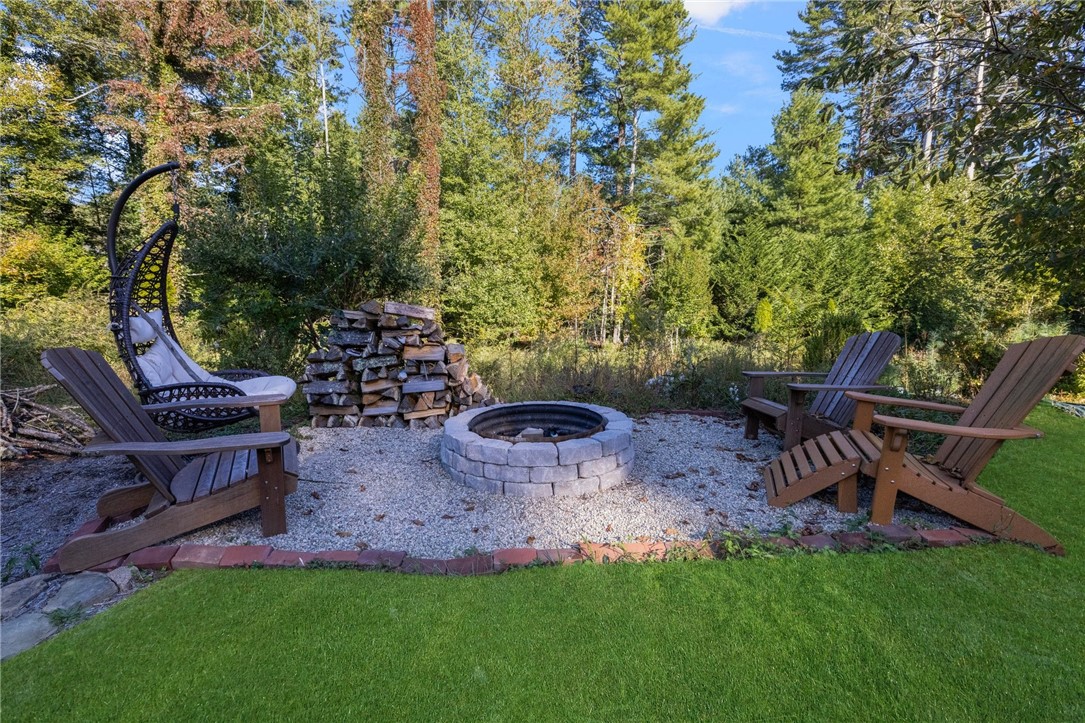 3 Timber Ridge Road Charlestown, RI 02813 - Photo 29 of 33 A firepit is fun to enjoy in any season.