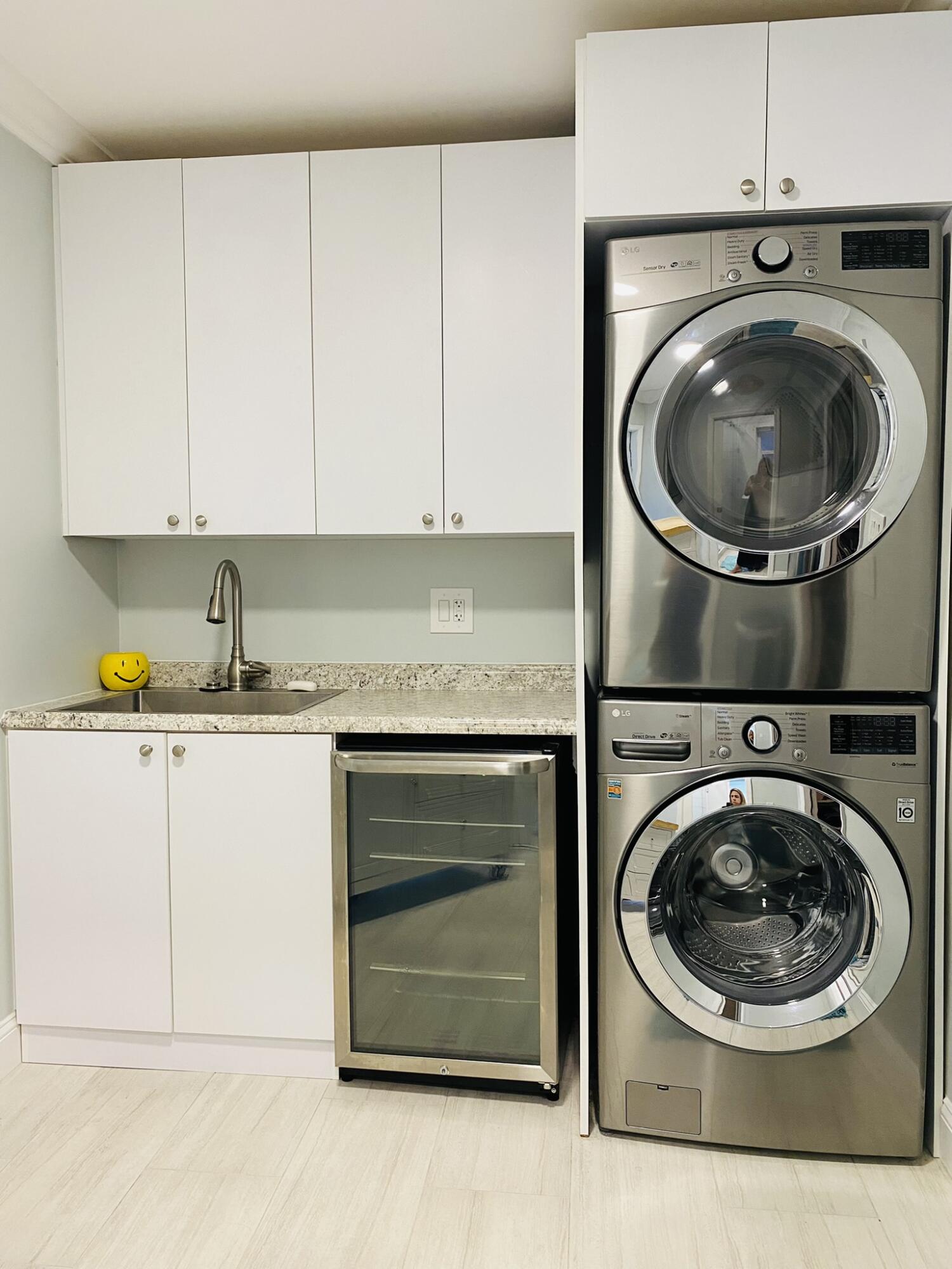 5501 North Ocean Boulevard Ocean Ridge, FL 33435 - Photo 12 of 21 a utility room with sink dryer and washer