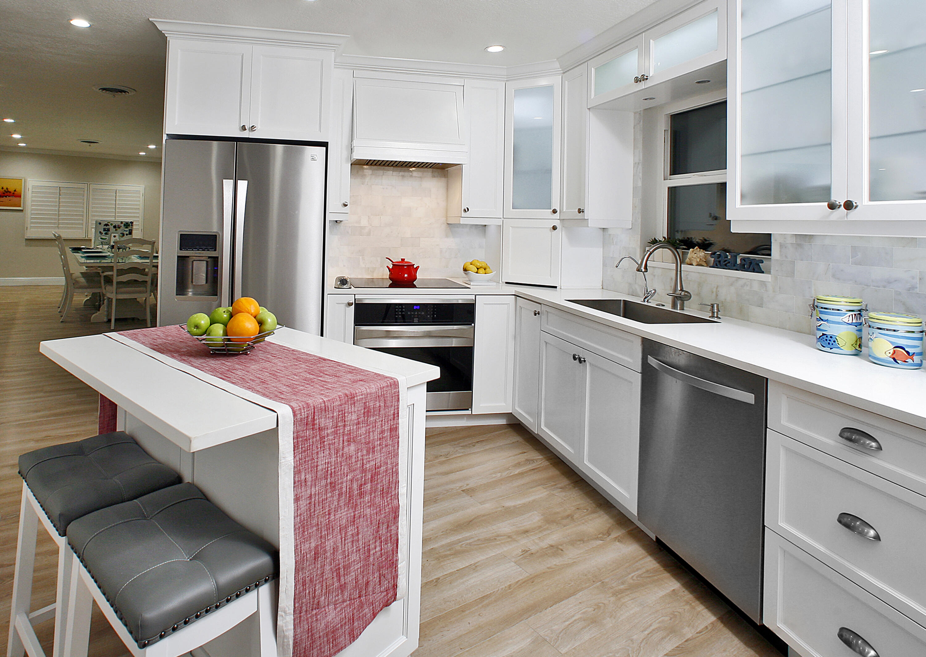 5501 North Ocean Boulevard Ocean Ridge, FL 33435 - Photo 2 of 21 a kitchen with stainless steel appliances a refrigerator sink and cabinets