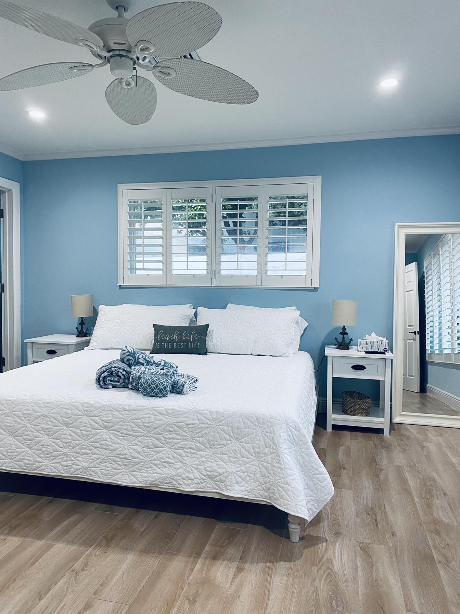 5501 North Ocean Boulevard Ocean Ridge, FL 33435 - Photo 5 of 21 a bedroom with a bed and window