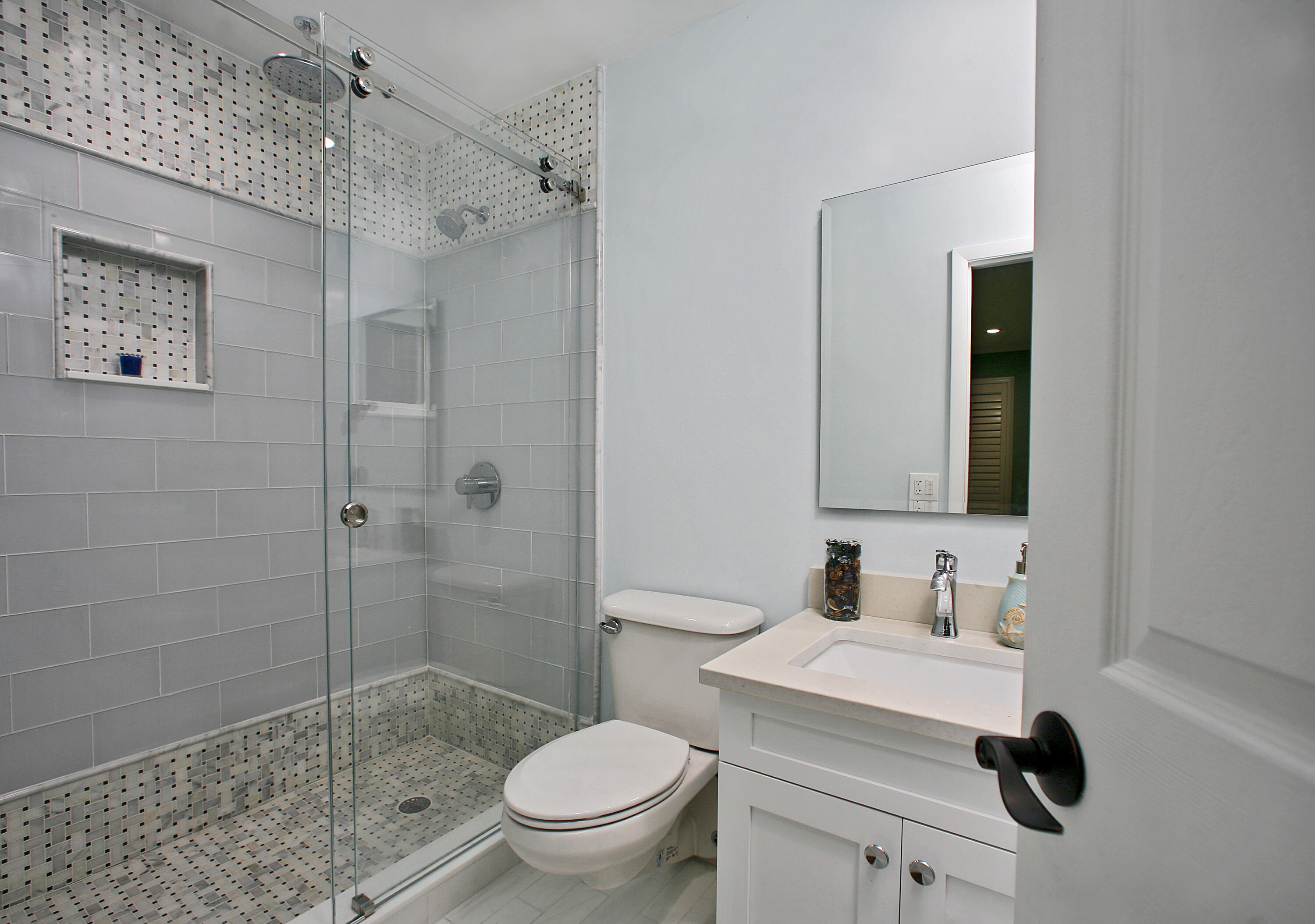 5501 North Ocean Boulevard Ocean Ridge, FL 33435 - Photo 7 of 21 a bathroom with a sink toilet and shower