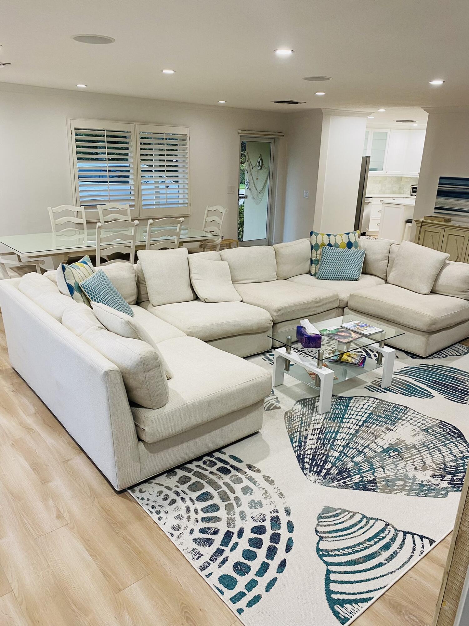 5501 North Ocean Boulevard Ocean Ridge, FL 33435 - Photo 9 of 21 a living room with furniture and a large window
