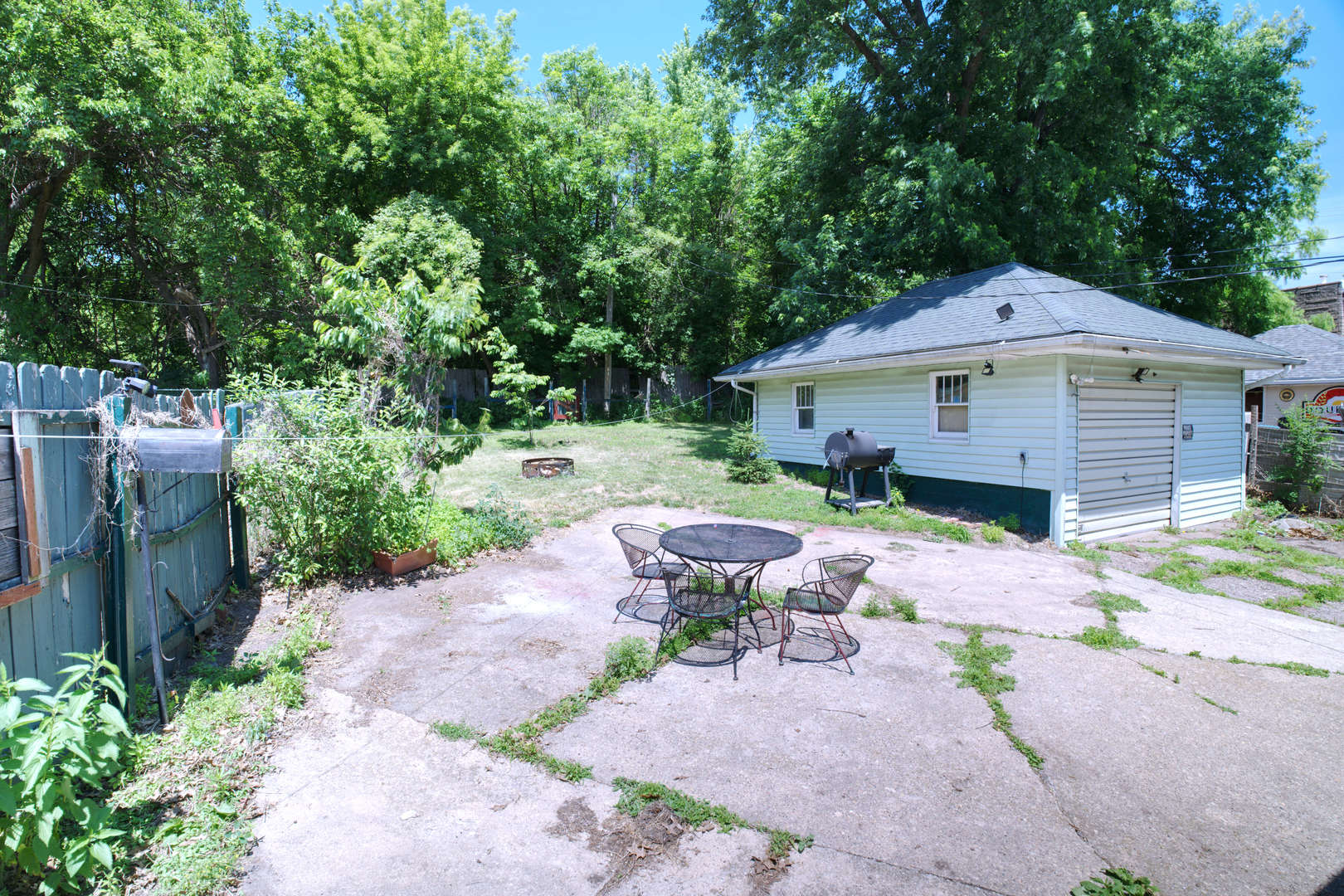 2108 Camanche Avenue Clinton, IA 52732 - Photo 18 of 22 a front view of a house with a garden and patio