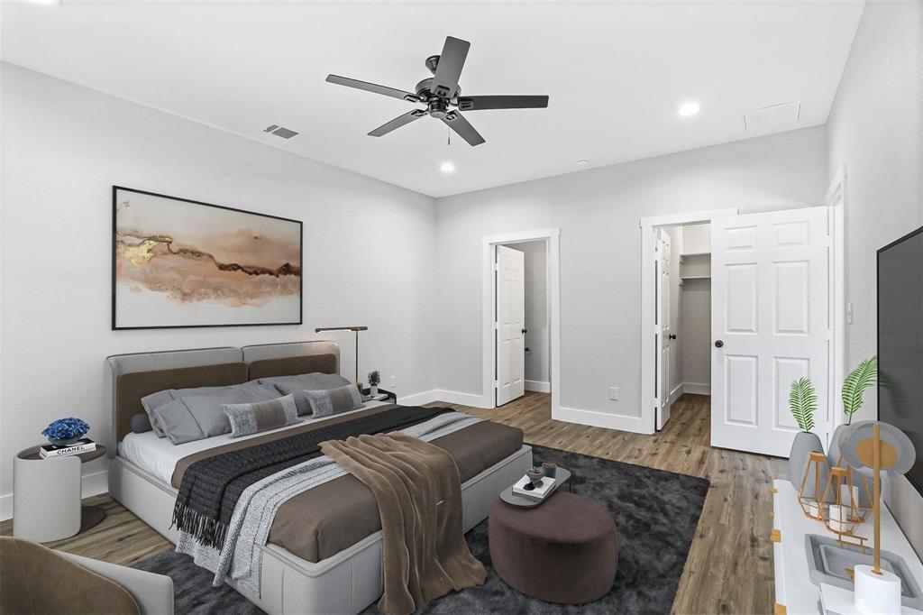 516 East Heron Street Denison, TX 75021 - Photo 10 of 24 a bedroom with a bed and glass walk in closet