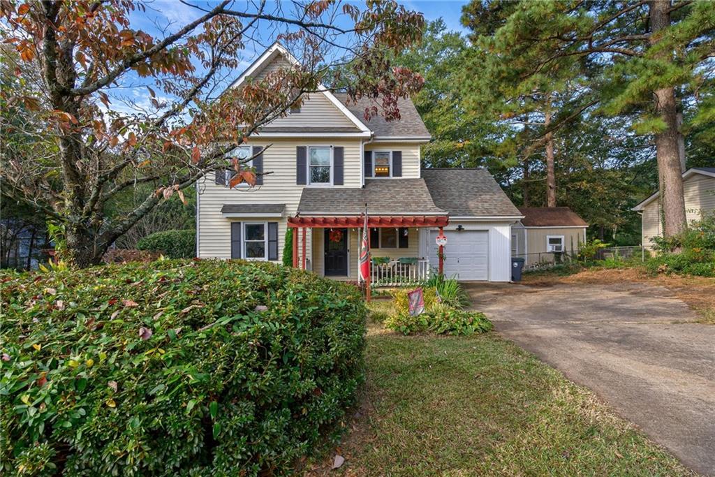 2821 Spring Street Dacula, GA 30019 - Photo 1 of 1 a front view of a house with yard and green space