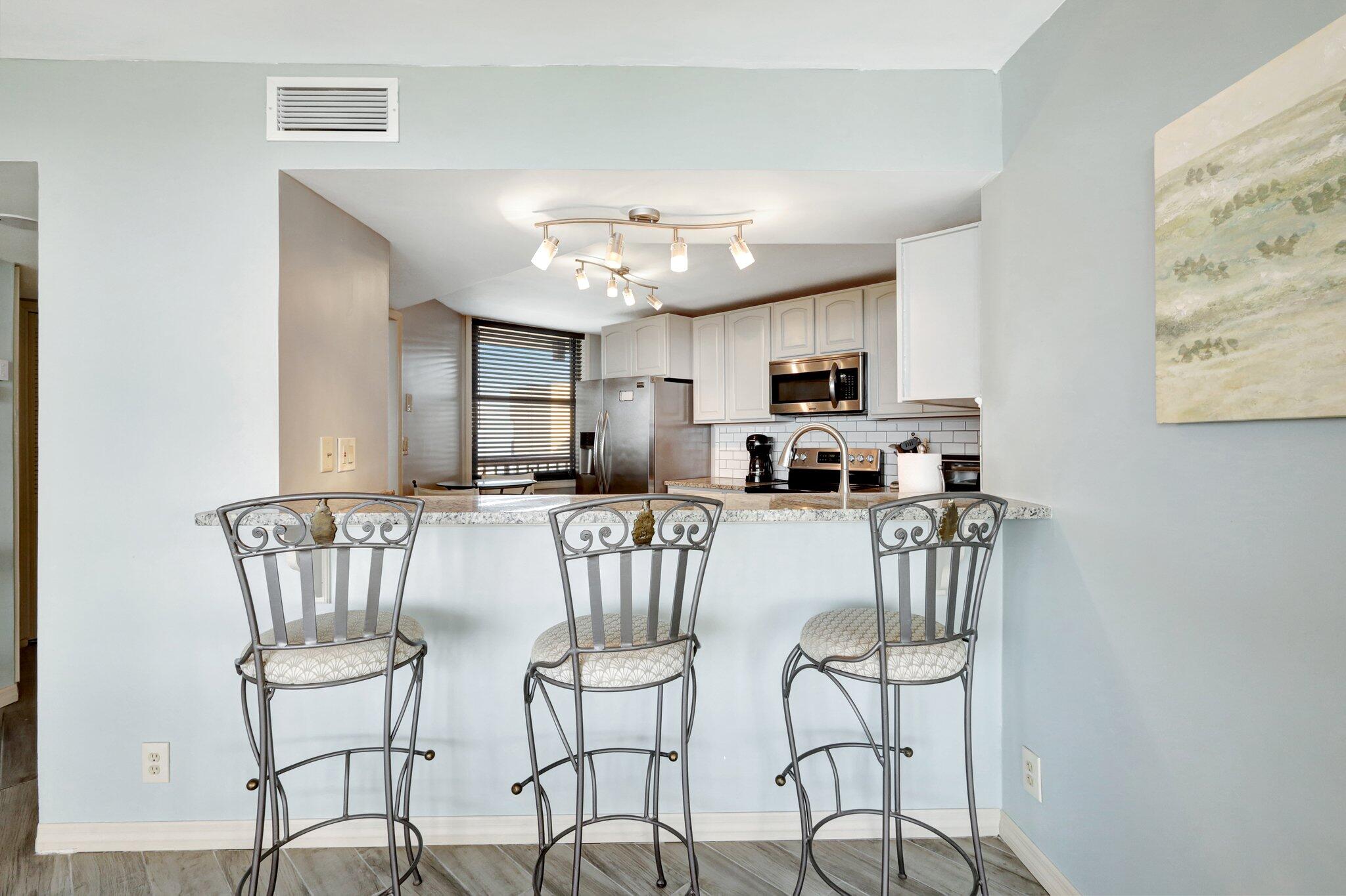9500 South Ocean Drive, Unit PH10 Jensen Beach, FL 34957 - Photo 11 of 41 a view of a dining room with furniture and a kitchen