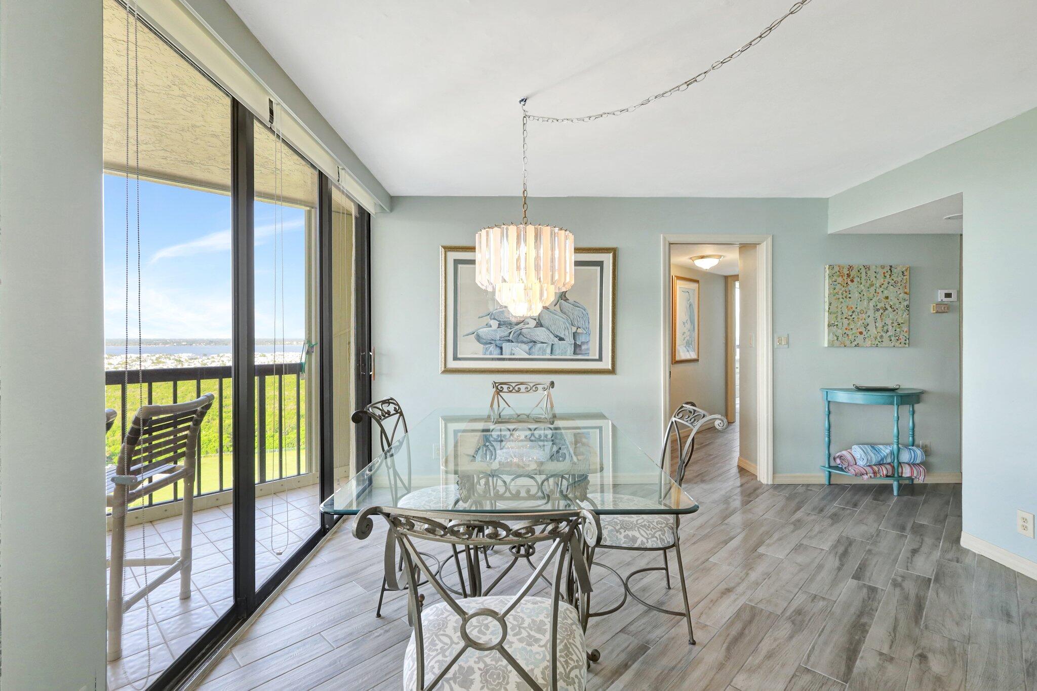 9500 South Ocean Drive, Unit PH10 Jensen Beach, FL 34957 - Photo 14 of 41 a dining room with furniture window wooden floor