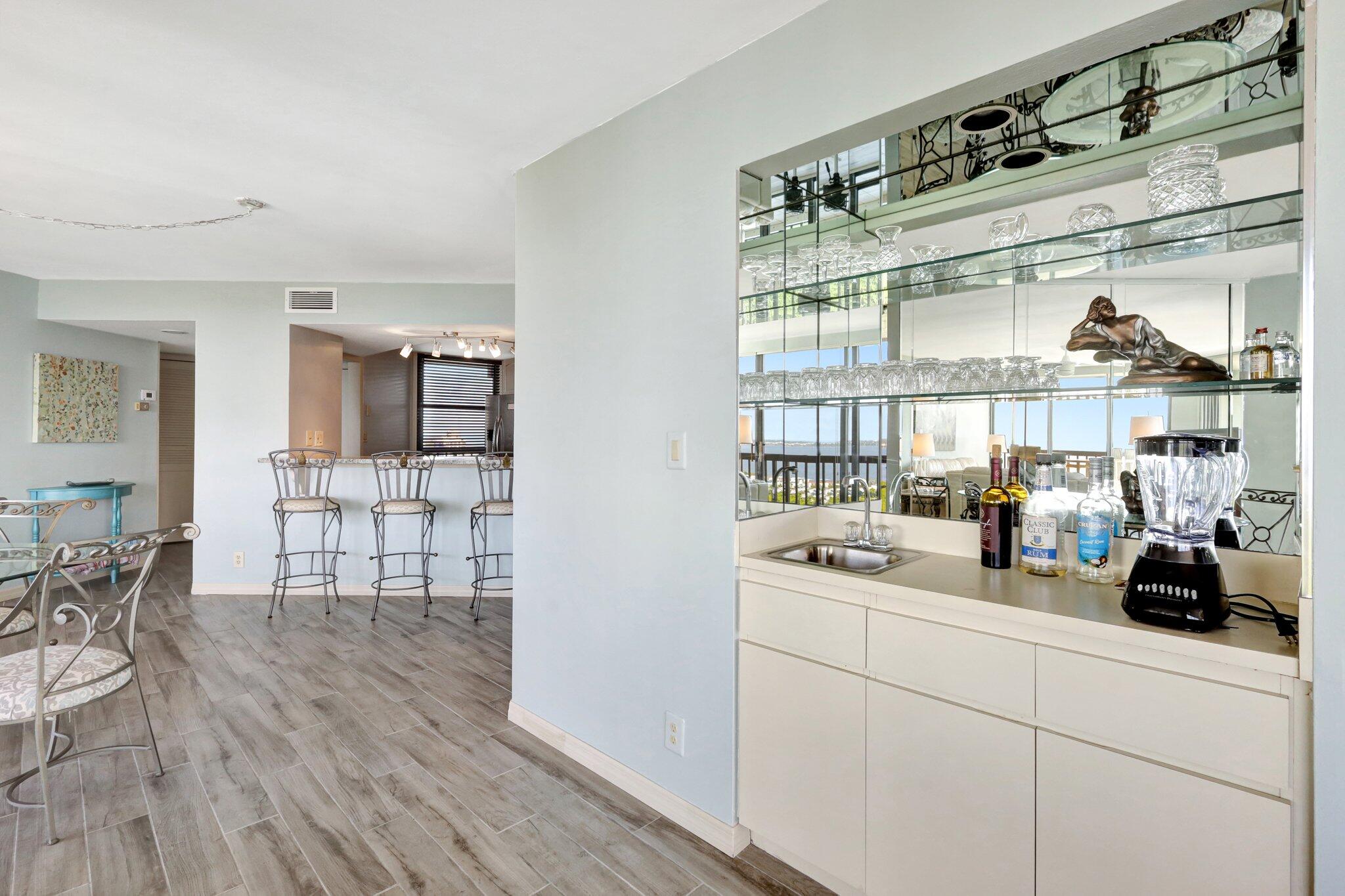 9500 South Ocean Drive, Unit PH10 Jensen Beach, FL 34957 - Photo 17 of 41 a kitchen with a sink and cabinets
