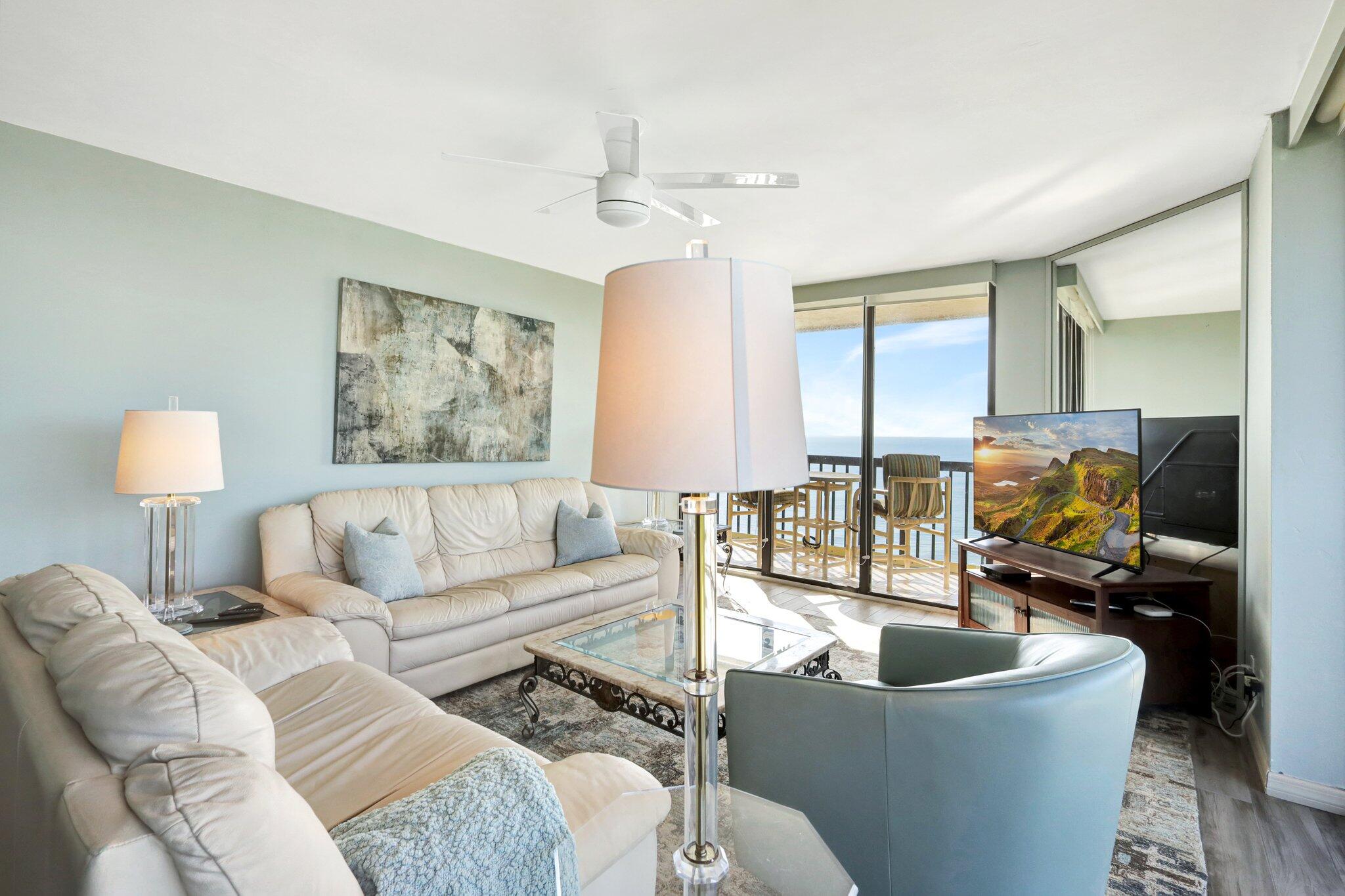 9500 South Ocean Drive, Unit PH10 Jensen Beach, FL 34957 - Photo 19 of 41 a living room with furniture and a lamp