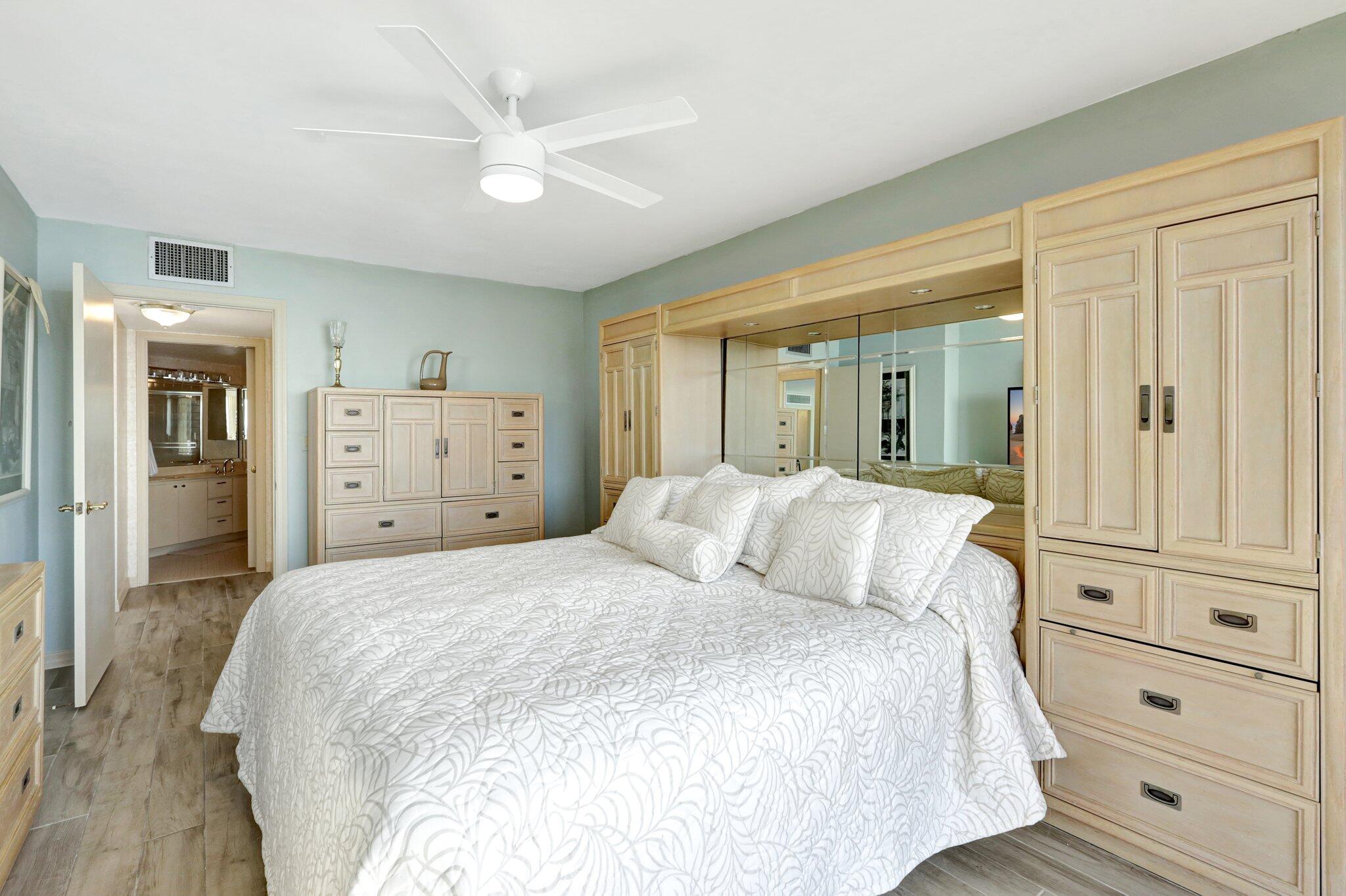 9500 South Ocean Drive, Unit PH10 Jensen Beach, FL 34957 - Photo 22 of 41 a bedroom with a large bed and ceiling fan