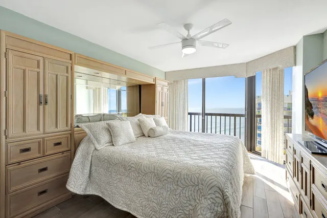 a bedroom with a large bed and a window