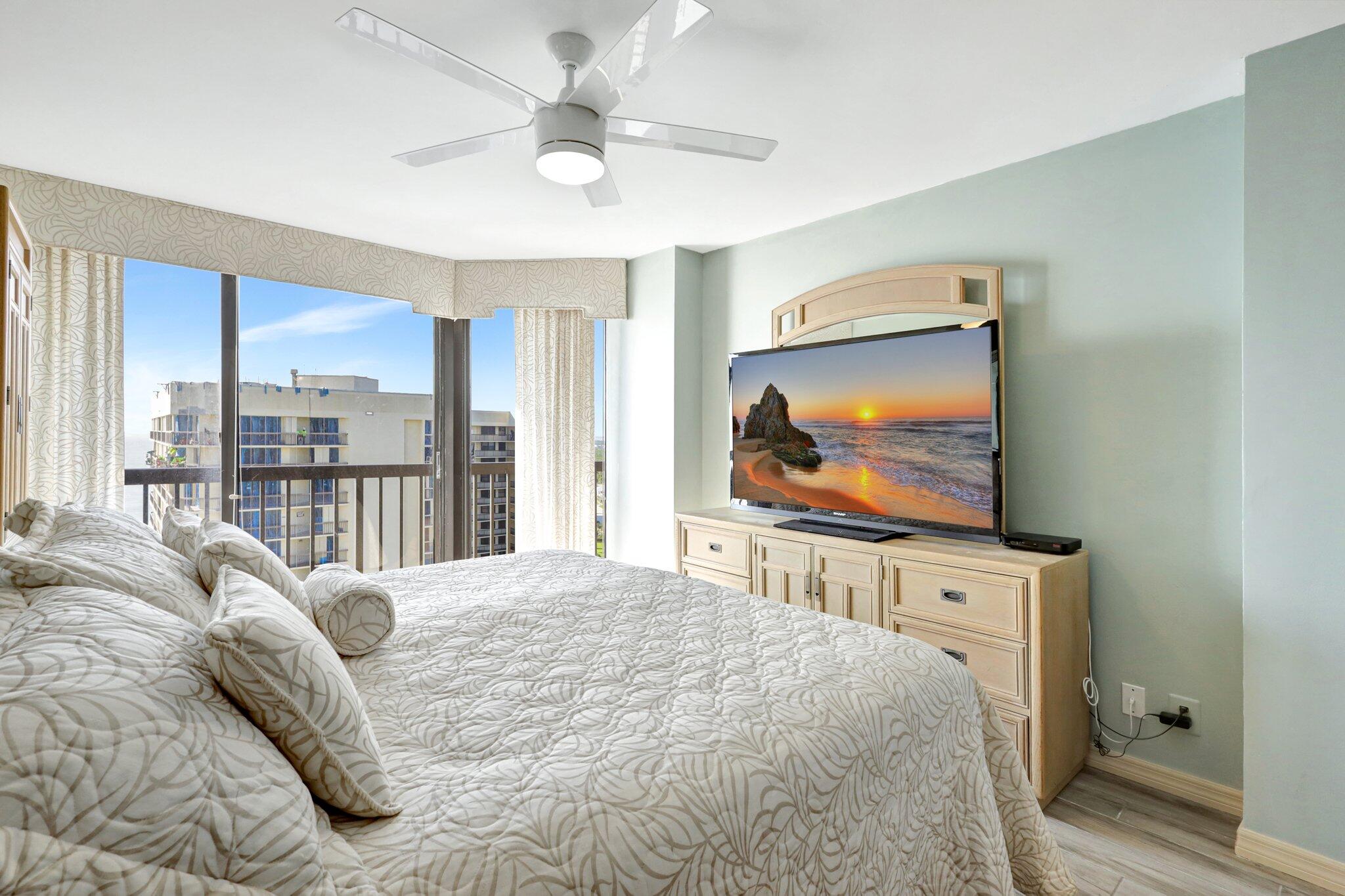 9500 South Ocean Drive, Unit PH10 Jensen Beach, FL 34957 - Photo 25 of 41 a bedroom with a large bed and a flat screen tv