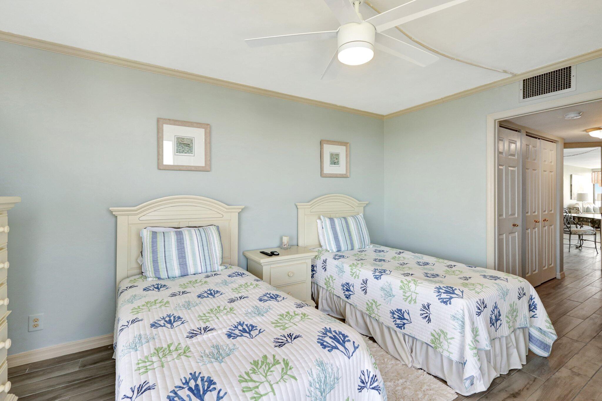 9500 South Ocean Drive, Unit PH10 Jensen Beach, FL 34957 - Photo 29 of 41 a bedroom with two beds and a night stand