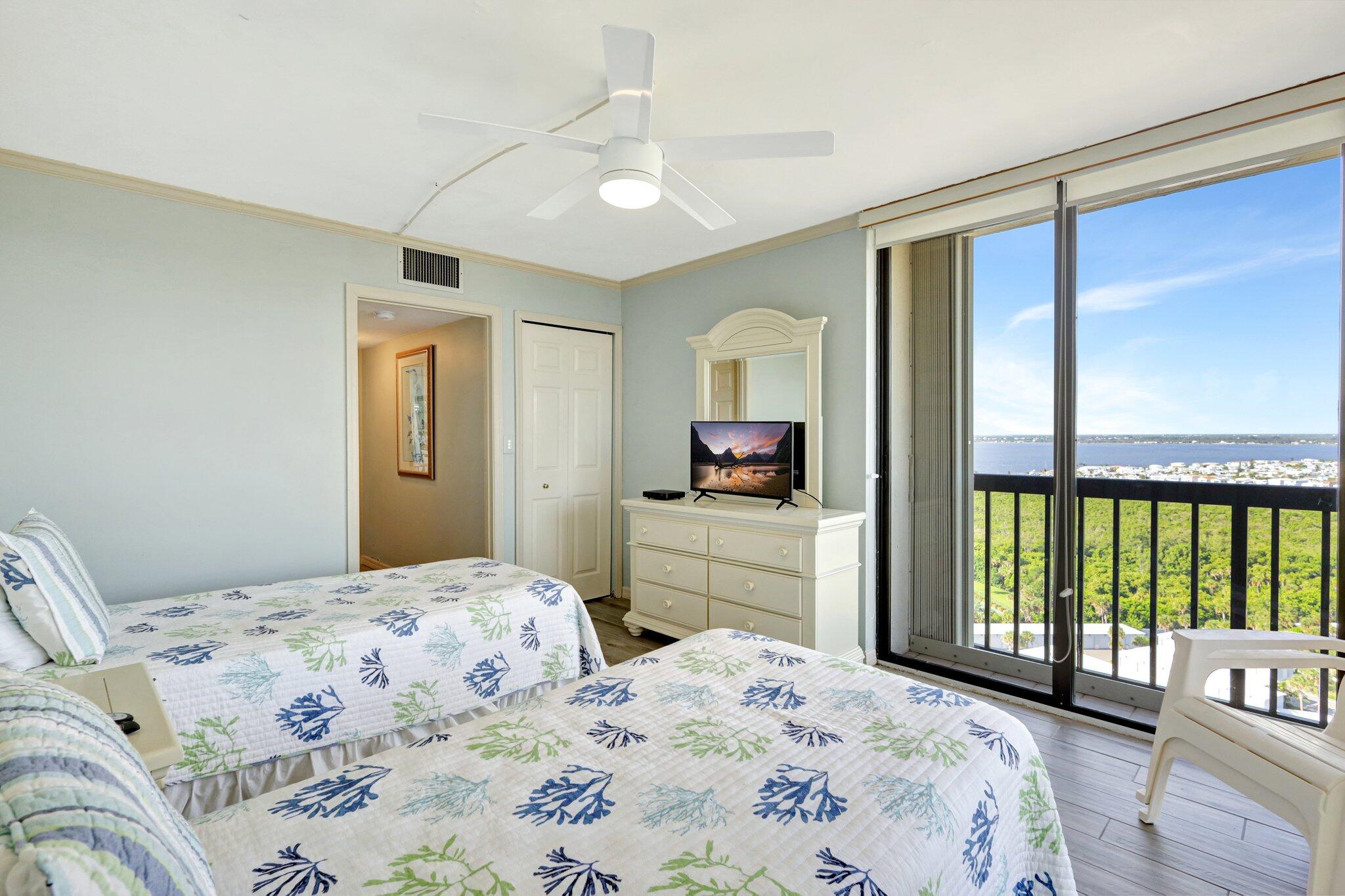 9500 South Ocean Drive, Unit PH10 Jensen Beach, FL 34957 - Photo 30 of 41 a bedroom with a bed and a large window with outer view