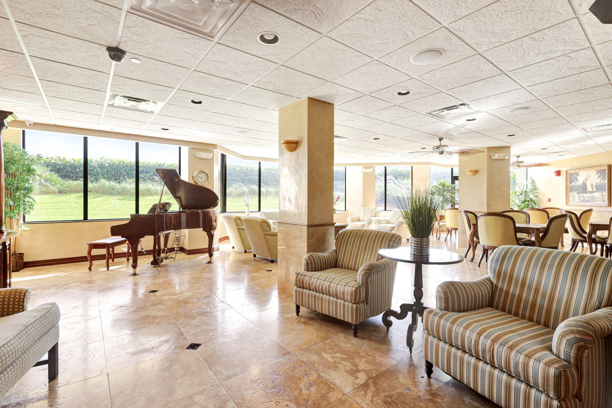 9500 South Ocean Drive, Unit PH10 Jensen Beach, FL 34957 - Photo 35 of 41 a living room with furniture and a large window with outer view