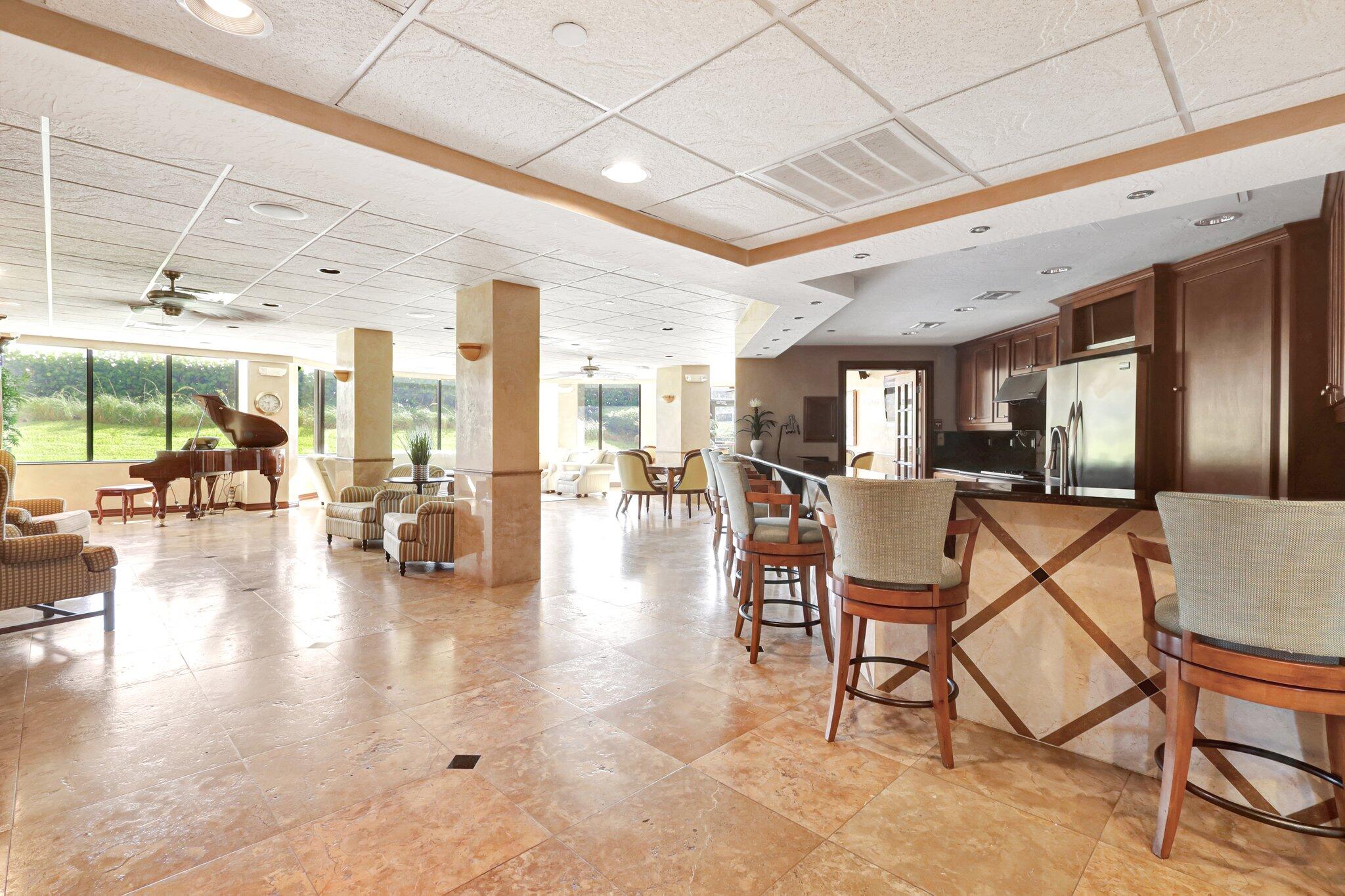 9500 South Ocean Drive, Unit PH10 Jensen Beach, FL 34957 - Photo 36 of 41 a lobby with furniture and floor to ceiling window