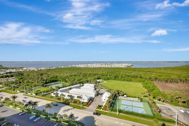 an aerial view of residential building and ocean