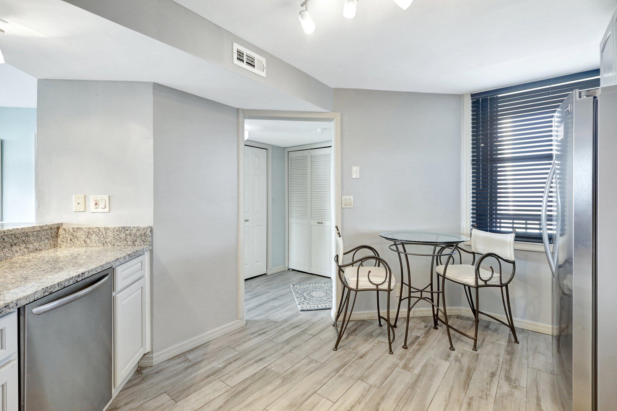 9500 South Ocean Drive, Unit PH10 Jensen Beach, FL 34957 - Photo 9 of 41 a view of a dining room with furniture and wooden floor