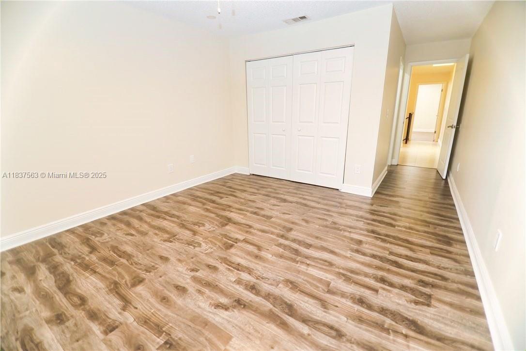 1654 Northeast 151st Street Miami, FL 33162 - Photo 13 of 19 a view of a room with wooden floor