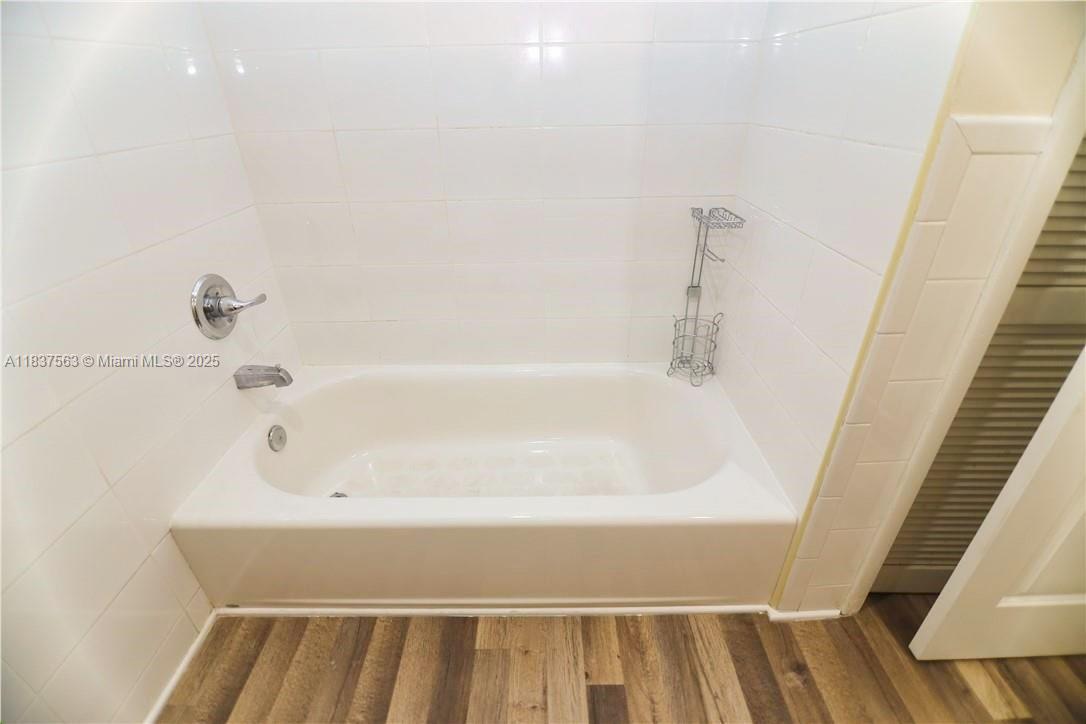 1654 Northeast 151st Street Miami, FL 33162 - Photo 14 of 19 a bathroom with a bathtub