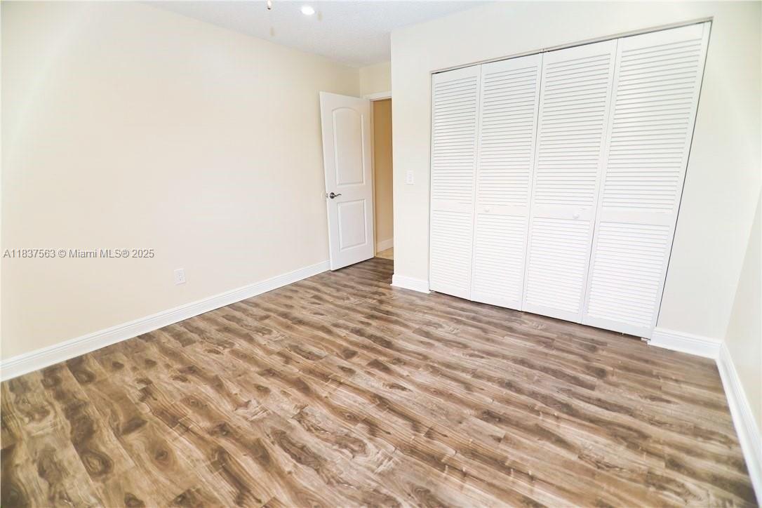 1654 Northeast 151st Street Miami, FL 33162 - Photo 16 of 19 a view of a room with wooden floor