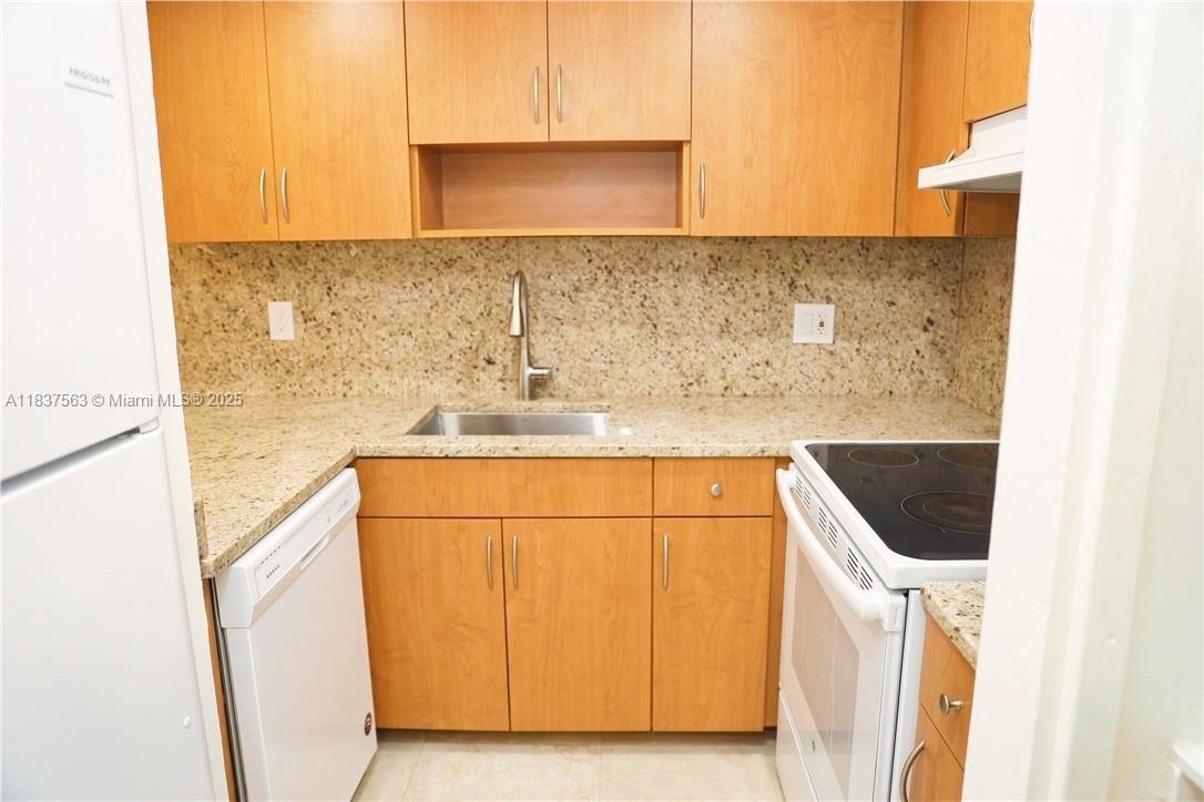 1654 Northeast 151st Street Miami, FL 33162 - Photo 4 of 19 a bathroom with a sink and a mirror